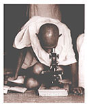 Studying leprosy germs, Sevagram Ashram, 1940: Gandhi believed in application of science to mitigate human sufferings